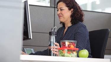 women working at her desk