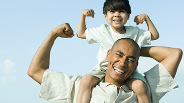 Man with boy on his shoulder