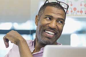 Man smiling and looking to the side